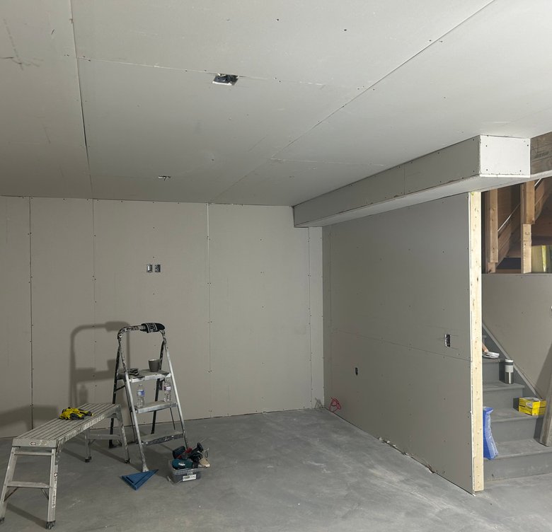 Basement hallway and stairway with quality flooring